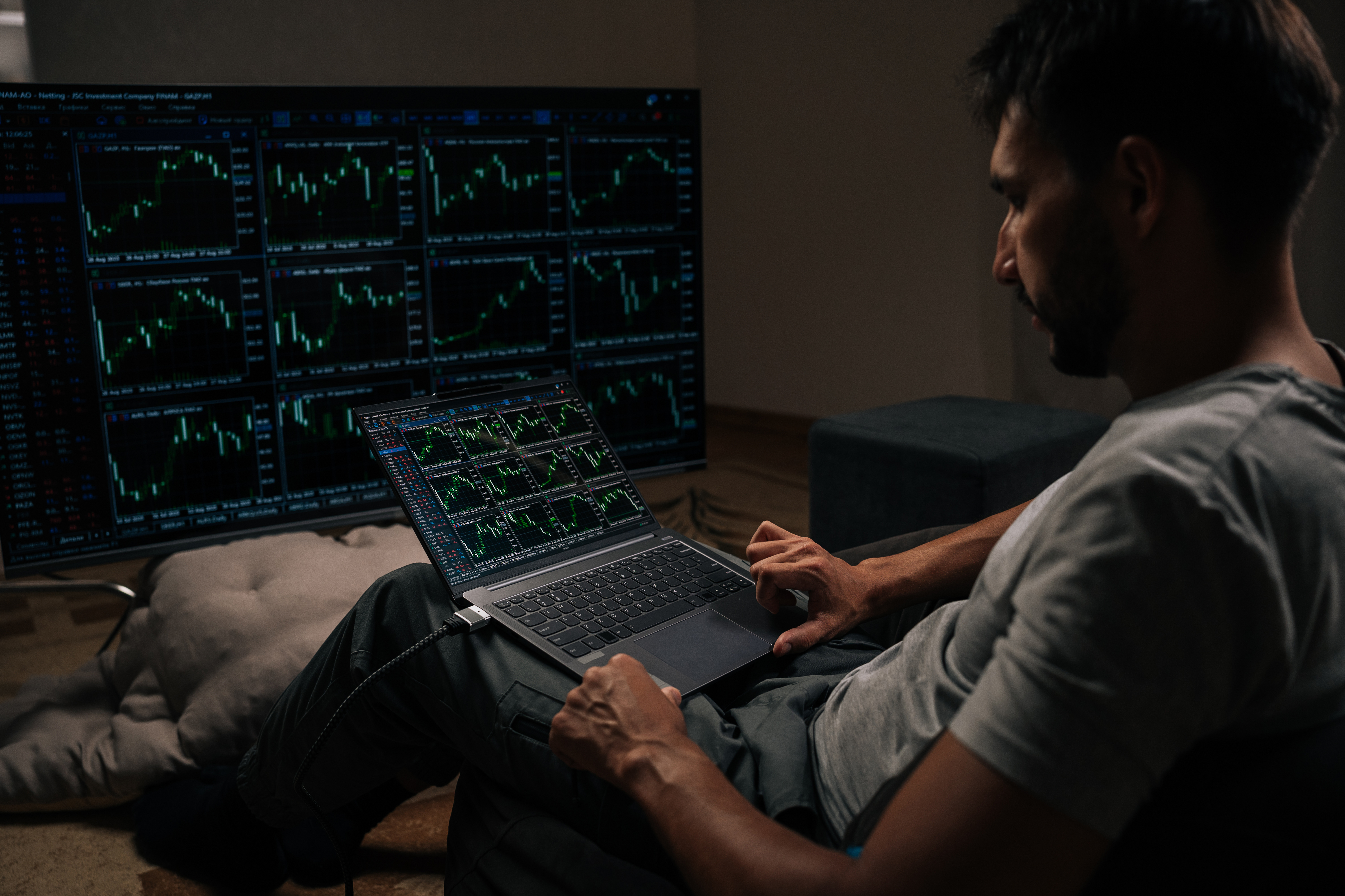 Trader watching multiple trading monitors